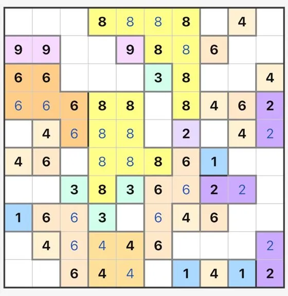 Fillomino gameplay: a 10 by 10 grid of coloured number regions.
